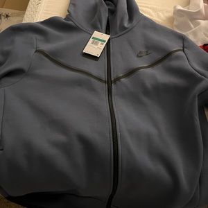Brand new Nike tech zip up. Too small for my man. I have the matching bottoms.